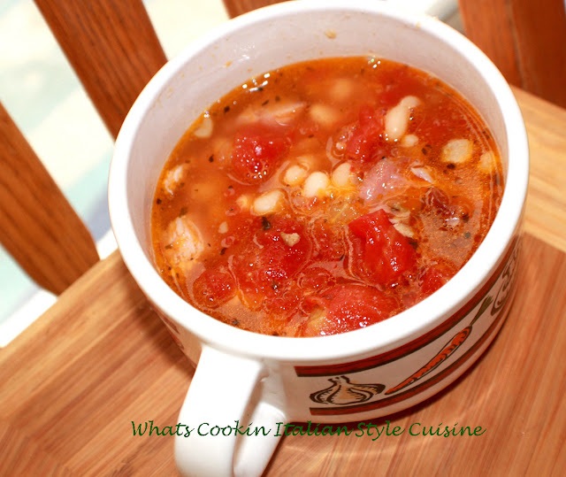 this is a bowl of smoked pork chop and white bean soup