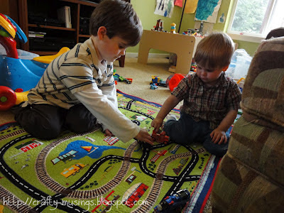 Big Bear and Little Bear play together on the new playmat.