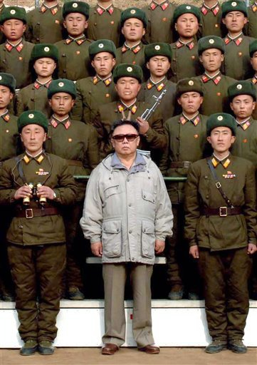 north korean women marching. marching men, huge statues