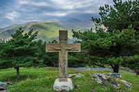 Cross in grove - Photo by Michael Bourgault on Unsplash