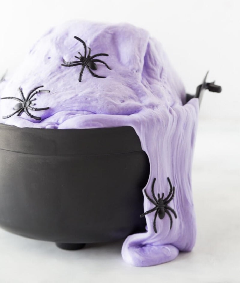 purple fluffy witches brew slime with spiders.