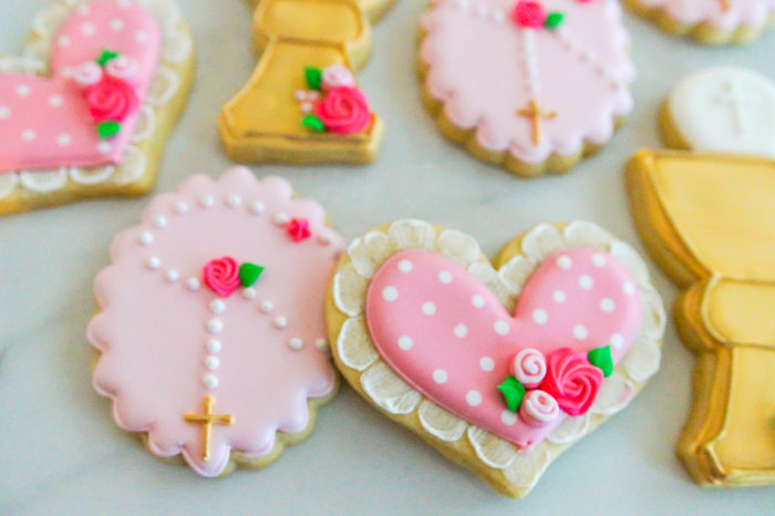 pink first communion decorated cookies - rosary with rose detail and pink lace heart cookie
