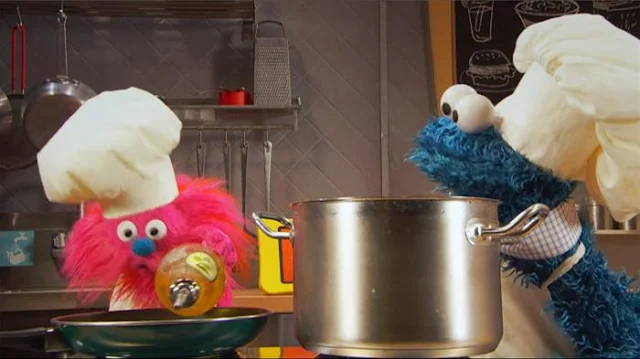 Sesame Street Episode 4812. Cookie Monster's Foodie Truck. A girl orders some angel hair pasta with vegetables from Cookie Monster and Gonger.