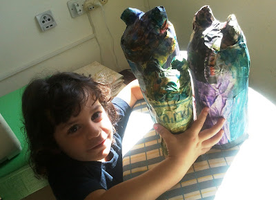 using papier-mache to turn three bottles into three bears