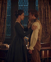Elizabeth attending to George injuries on his face after a fight with Ross