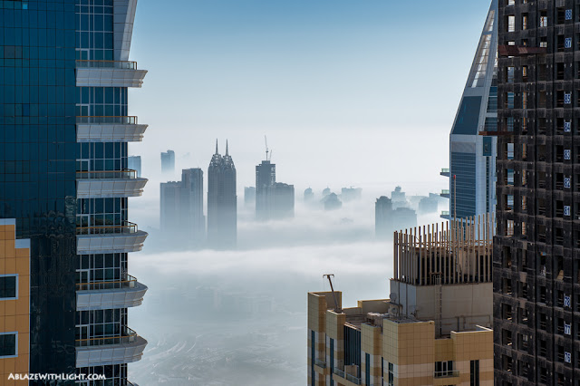 Photo of Dubai buildings in the fog