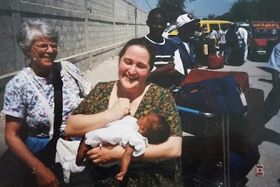 Wendy Goetze in Haiti with her new daughter.