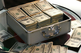 Image containing a box full of money