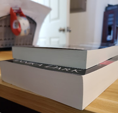 Image of Crossbreed Insider's guide paperback comparing the size to Keystone