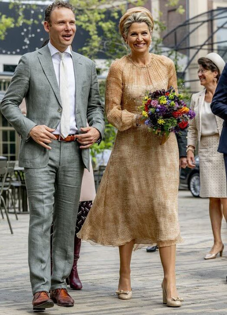 Queen Maxima wore a midi dress by Natan, Edouard Vermeulen. Salvatore Ferradamo flower heel shoe. Fabienne Delvigne Hat