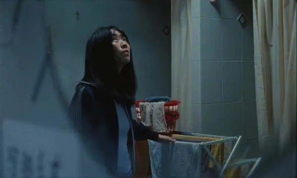 Amy (Ke-Xi Wu) appears in a scene from “Blue Sun Palace.” (c) Dekanalog