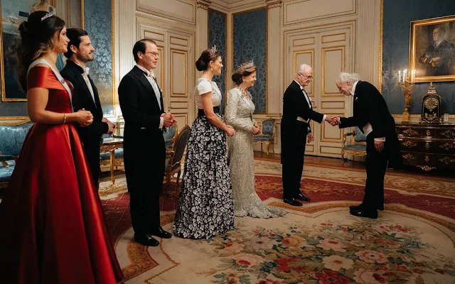 Crown Princess Victoria is wearing Camilla Thulin floral skirt and Connaught tiara. Princess Sofia is wearing Ida Lanto red gown