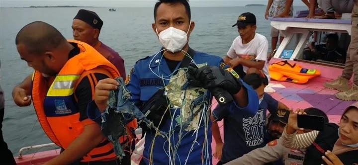 The first pictures of the wreckage of the crashed Indonesian plane