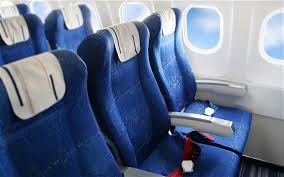 a row of blue airplane seats