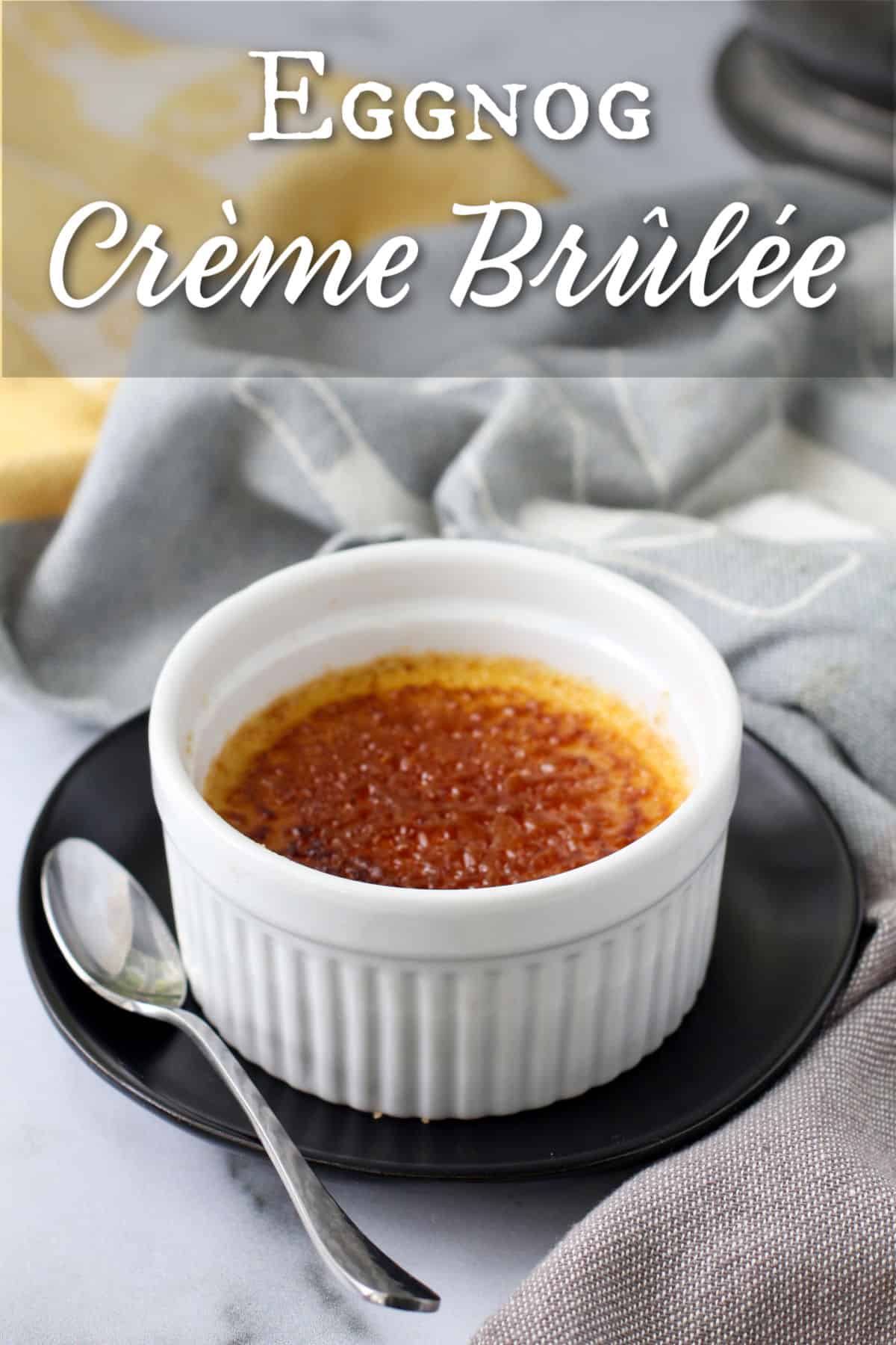 Eggnog Crème Brûlée (Small Batch) with a spoon on the side.