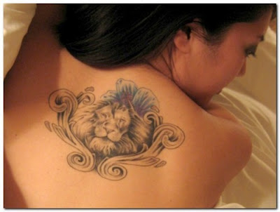 lion tattoo on his back