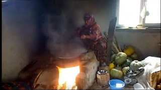 Grape Molasses final stage on fire after boiling in a cauldron to boil over