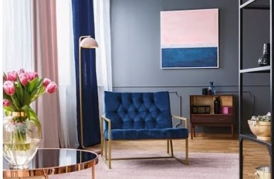 grey livingroom with blue and gold chair pink curtains