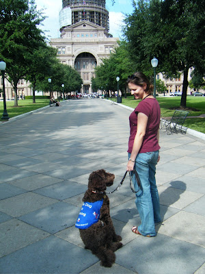 Alfie and me on the walkway leading up to the main entrance of the Capitol; he's jacketed and sitting all relaxed next to me