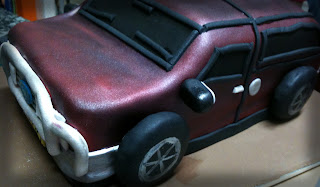 Real red velvet cake with no food colouring, cream cheese frosting to make an F250 birhday cake, carved, crumb coated, fondant covered trimmed, airbrushed with maroon and silver. trim added, bullbar, window and door trim, side mirror, badges, caramel crown tyres