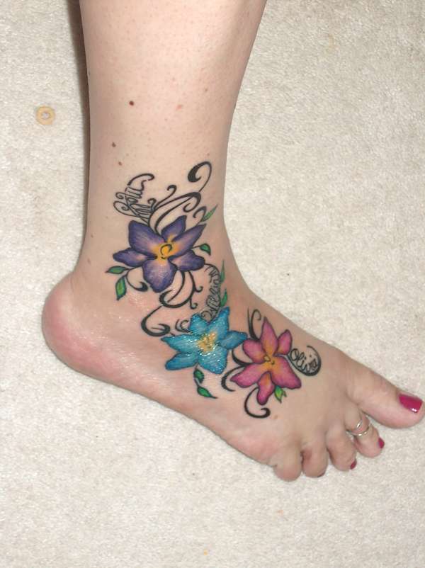 small flower tattoo. small heart tattoos on foot.