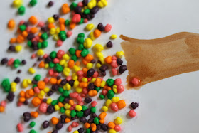 Instead of eating all that Halloween candy, kids can use it to make colorful fall trees.