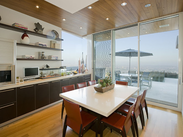 Small second kitchen and dining table in the modern mansion with the view