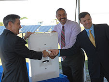 Kennedy Space Center Director Bob Cabana, left, Roderick Roche of SunPower Corp., and Florida power & LIght's Eric Silagy symbolically turn on the one megawatt solar energy center at KSC