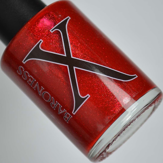 red shimmer nail polish in a bottle