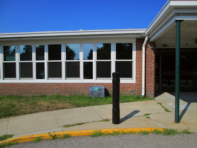 school windows reflecting sky