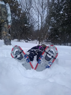 Person laying down in the snow