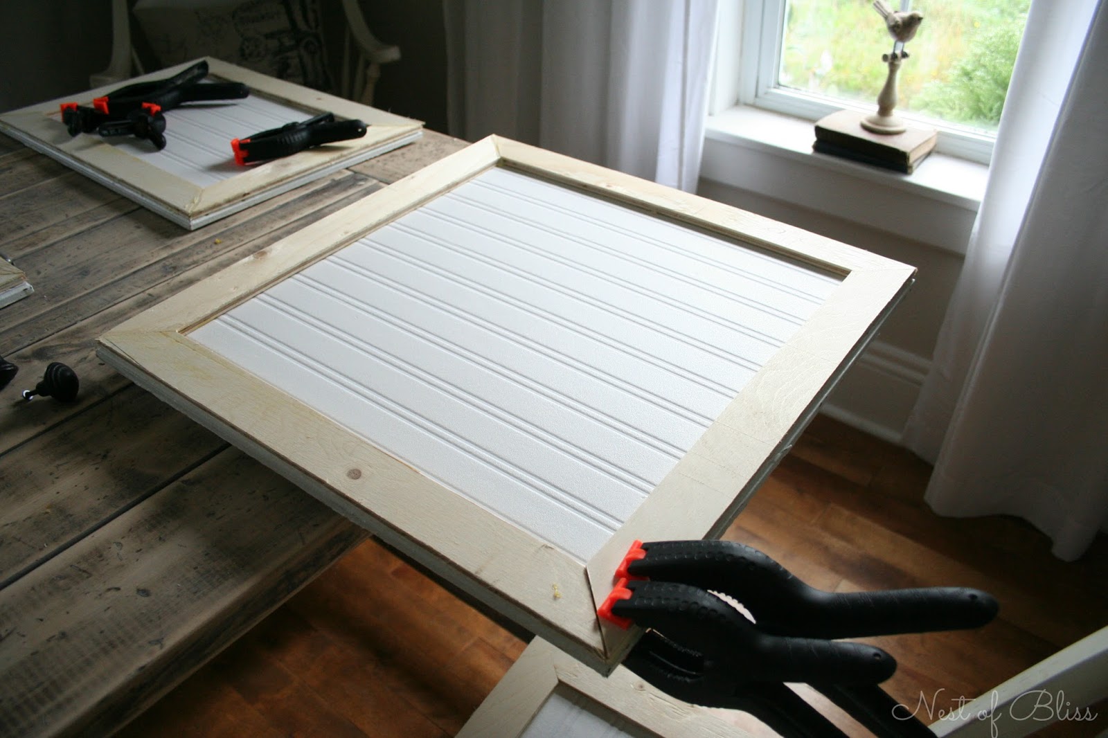 Tip: We used clamps on our doors as the wood glue dried, this is ...