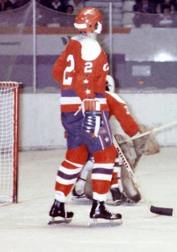 Jack Lynch (2) stands guard alongside crouching goalie Bernie Wolfe.