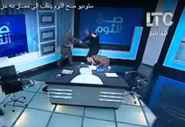 Mufti beatin live on TV with shoe over women head scarf dedabe