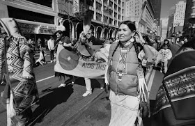 Sacheen Littlefeather marching in a street parade, San Francisco, 1990