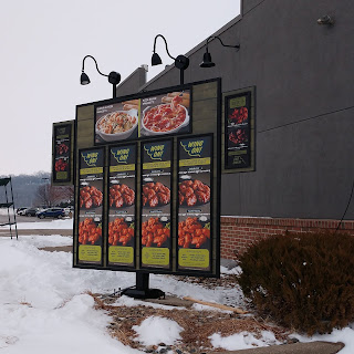 menu board at the Sioux City Fazoli's restaurant displayed before the restaurant's opening, primarily highlighting wings