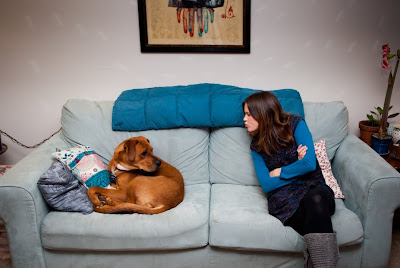 dog and woman on couch