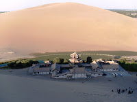 A view of the Crescent Moon Lake oasis from atop the sand dunes