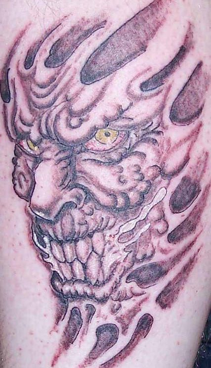 Evil Demon Skin Rip Tattoo