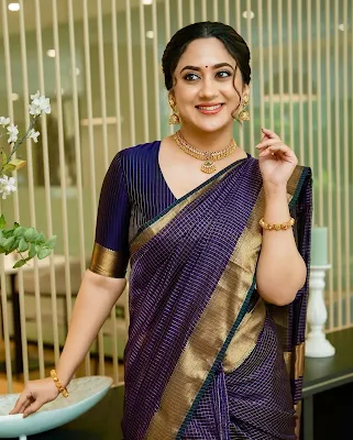 Miya George showcases teal saree elegance in 2025 shoot