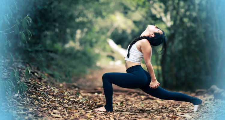 A woman gracefully practicing yoga in a serene forest setting, finding inner peace and harmony amidst nature's beauty.