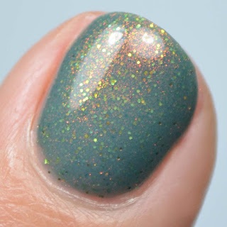 teal nail polish with shimmer and micro glitter