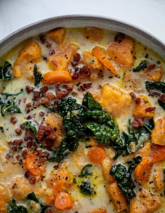 This sweet potato chowder is a hug in a bowl! Made with lots of greens and crunchy pancetta and pepitas for topping, it's a perfect weeknight meal.