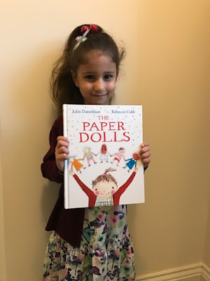 Child dressed as the girl from the Paper Dolls book