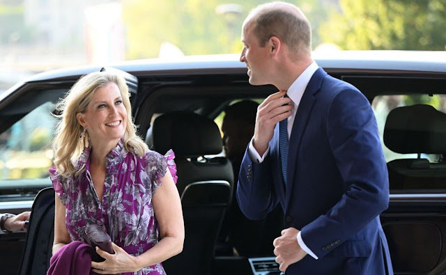 The Duchess of-Edinburgh wore a new Roisin purple printed voile midi silk dress by Erdem. Diamond earrings