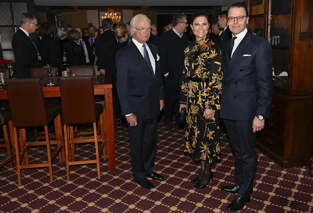 Crown Princess Victoria wore a Dora gold flower silk dress Dagmar. Gold diamond drop earrings