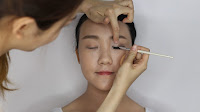 Modern Oriental Bridal Makeup -  Re-apply the gel eyeliner on the upper lashline
