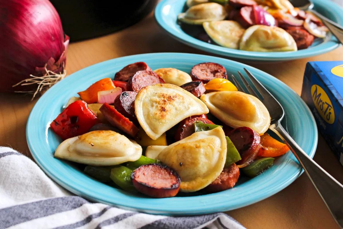 Kielbasa, Pepper, Onion, and Pierogy Hash is a simple and easy to prepare recipe that is on the table in less than 30 minutes. It's the perfect family meal for busy days!