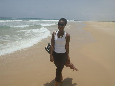 Woman walking on beach at lake rose in sengal