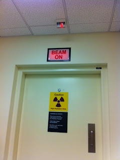 door to radiation room with beam on light on 